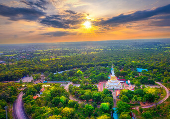 Aerial view of Phra That Nadoon or Wat Na Dun Pagoda at sunrise, Beautiful landmark and famous holy...