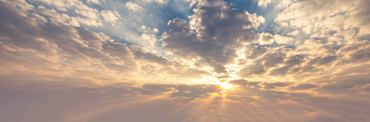 Beautiful sunset sky and clouds with dramatic light, Twilight sky and sun rays, Orange and red sky background with light of the sun-Image