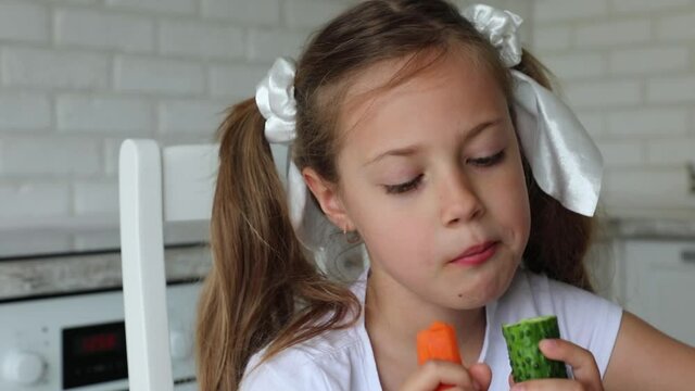 child like eating fruits and vegetables. little girl eats vegetables and fruits with joy and pleasure