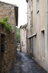 Fototapeta na wymiar The medieval stone architecture and the old narrow street of Lagrasse, the most beautiful medieval village of France, located in the picturesque mountain valley in Pyrenees