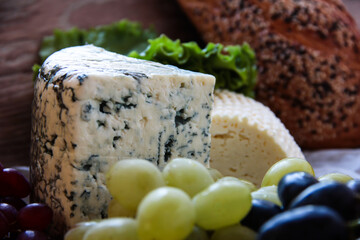 Cheese with mold on the background of products.