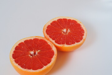 Naklejka na ściany i meble Fruits are citrus fruits. Red grapefruit cut in half. High