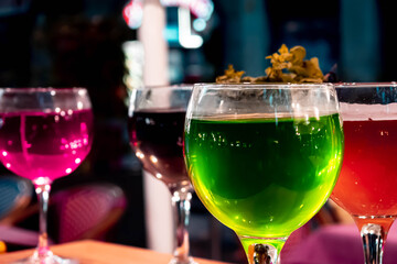 colorful cocktail drinks in the table of a restaurant 