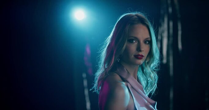 4K Slow Mo Of Attractive Woman Posing Under Spotlight