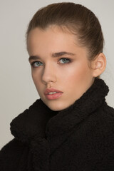 Portrait of a blonde girl with a beautiful and stylish face