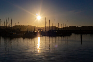 Dock full of ships in the dusk hour