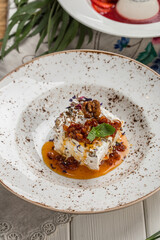 meringue cake dessert with nuts on the table at restaurant