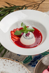 Panna cotta with Strawberry Sauce Italian dessert on the table at restaurant