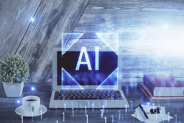 Double exposure of desktop computer and technology theme hologram. Concept of software development.