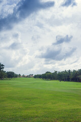 Golf course in Dominican republic. field of grass and coconut palms on Seychelles island.