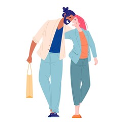 young woman and man walking and hugging