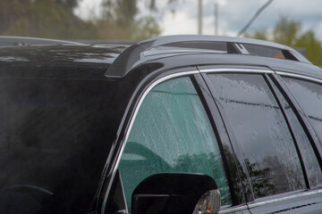 Black Car at the self-service car wash.