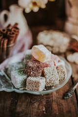 Turkish Delight - a gelatinous sweet confection traditionally made of syrup and cornflour, dusted with icing sugar. Still life food - oriental sweet rahat lokum . Candy marshmallow.