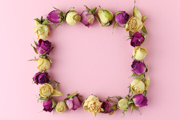 Autumn floral composition. Frame made of dried flowers and leaves on pink  background. Autumn, fall concept. Flat lay, top view, copy space