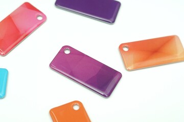 many access cards, key chains, different colors on a white background, individual access cards to the room