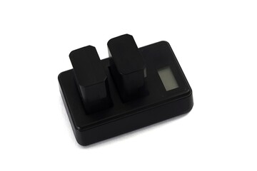 charger with batteries on white background