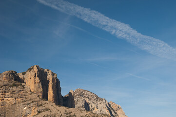 Mallos de Laza and contrails of airplanes. Natural Park of the Mountains and Canyons of Guara. Huesca. Aragon. Spain.