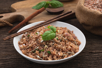 space brown rice fire with small fish on wood