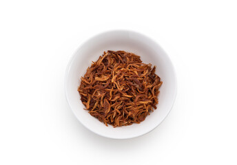 Fried shallots in dish on white background
