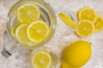 glass of water with lemon. Flat lay top-down