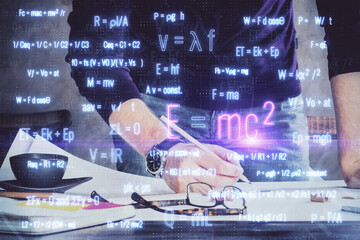 Student or teacher with mathematical and scientific formulas. Concepts of education.