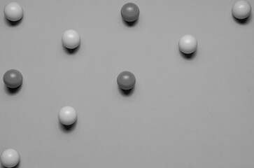 Black and white shot, from small balls placed in line, space for text
