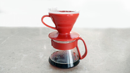 Pourover. V60. Fresh hot coffee filter dripping into the glass server