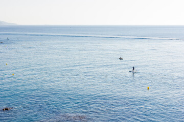 Fototapeta na wymiar Paddle surf on the Mediterranean Sea