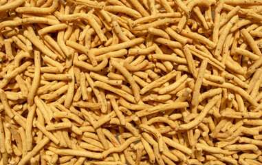 Ratlami Sev background. Popular Gujarati snack. Ratlami Masala Sev. Top view. Indian street snack.