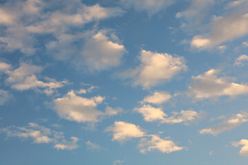 Bright white clouds over blue sky