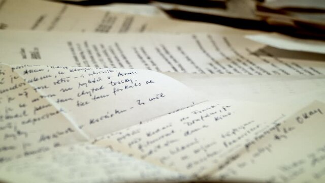 Scattered White Paper Printed Documents On Tabletop - Closeup Shot (Pan Right)