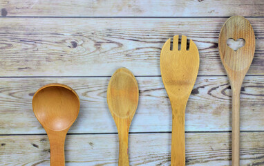 Wooden utensils on some boards, creating a vintage shot
