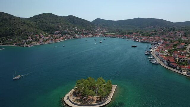 Aerial drone video of picturesque village capital and port of Ithaki or Ithaca island called Vathi a safe anchoring for sailboats, Ionian, Greece