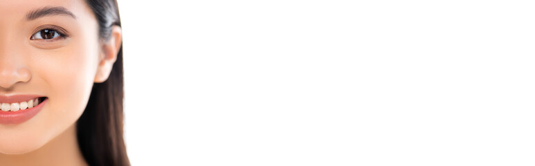 Obraz premium Panoramic shot of excited young asian woman looking at camera isolated on white