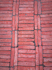 Old red brick sidewalk. Rustic style. Background texture.