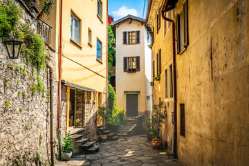 Gandria village scenic laneway with colorful houses and dramatic light in Gandria Ticino Switzerland