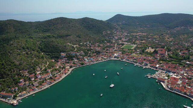 Aerial drone video of picturesque village capital and port of Ithaki or Ithaca island called Vathi a safe anchoring for sailboats, Ionian, Greece