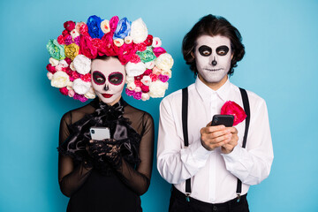 Photo of cute spooky two people man lady hold telephones read news undead saint run for president...