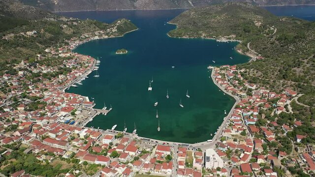 Aerial drone video of picturesque village capital and port of Ithaki or Ithaca island called Vathi a safe anchoring for sailboats, Ionian, Greece