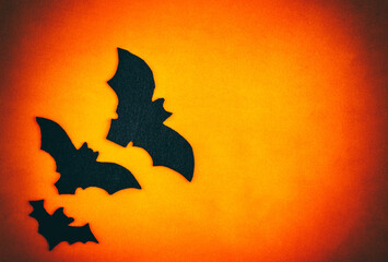 Fototapeta premium Halloween holiday concept. Halloween decorations orange background. The layout of the greeting card. Copy space