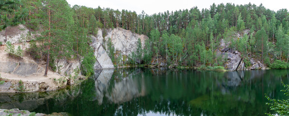 Rocks near the flooded Talkov Kamen quarry, Russia