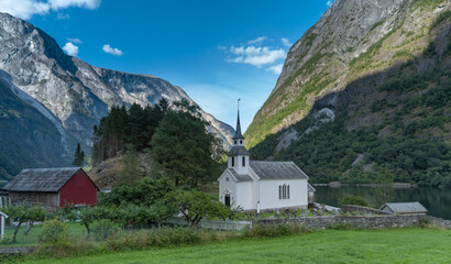 Fototapeta na wymiar Undredal, a small fishing village on the shores of the Aurlandsfjorden, a branch off the massive Sognefjorden, Vestland, Norway, Home to the smallest stave church in Northern Europe, built in 1147