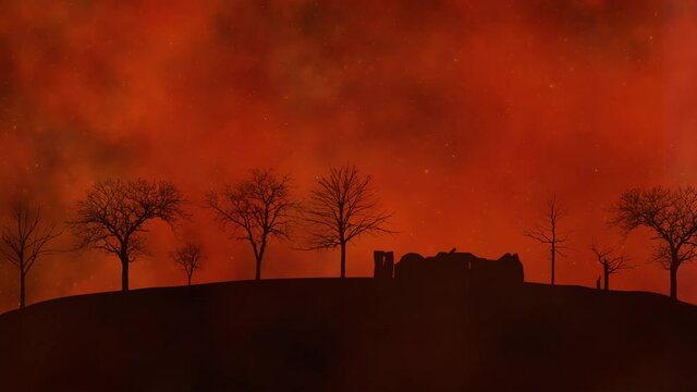 The silhouette of a burned house and burned trees destroyed by raging wildfires.