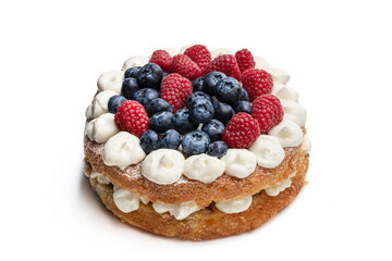 Victoria sponge cake with whipped cream and berries on top isolated on white