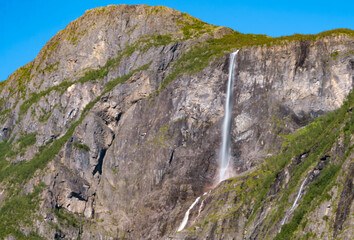 Stunning views the mountains and waterfalls surrounding of the Naeroyfjord, listed as a UNESCO World Heritage Site in the Aurland Municipality in Vestland county, Norway.