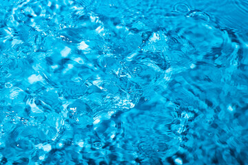 splash of water on a blue background. Abstract wallpaper