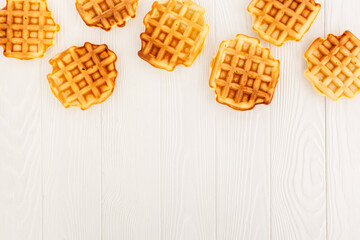 belgian waffles on wooden background top view mockup