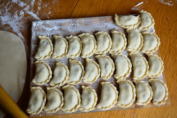 Fototapeta premium Raw materials for making Pierogi with potatoes, which are prepared for cooking