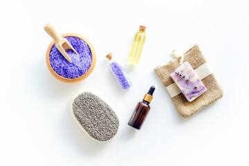 Lavender spa set. Violet bath salt and essence oil on white background