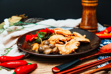 wok fried chicken stir fry with sweet peppers and chinese vegetables